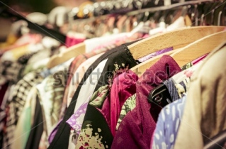 stock-photo-clothes-on-a-rack-on-a-flea-market-203295997